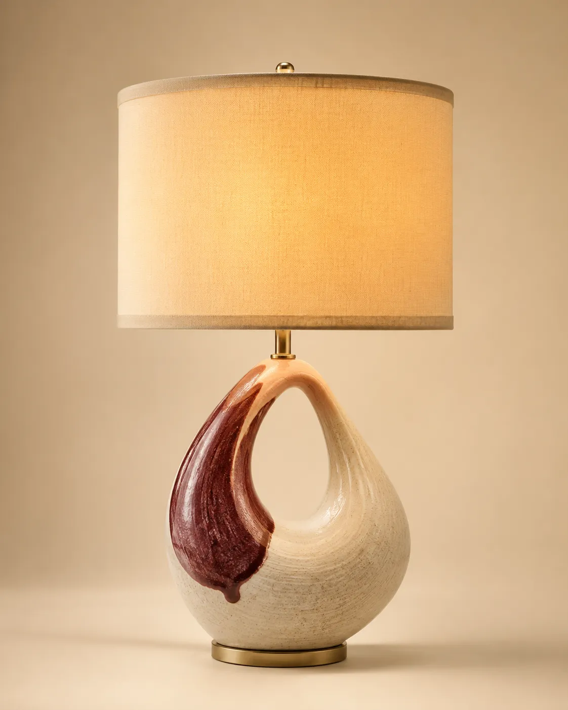Decorative accent table lamp glowing on a styled console
