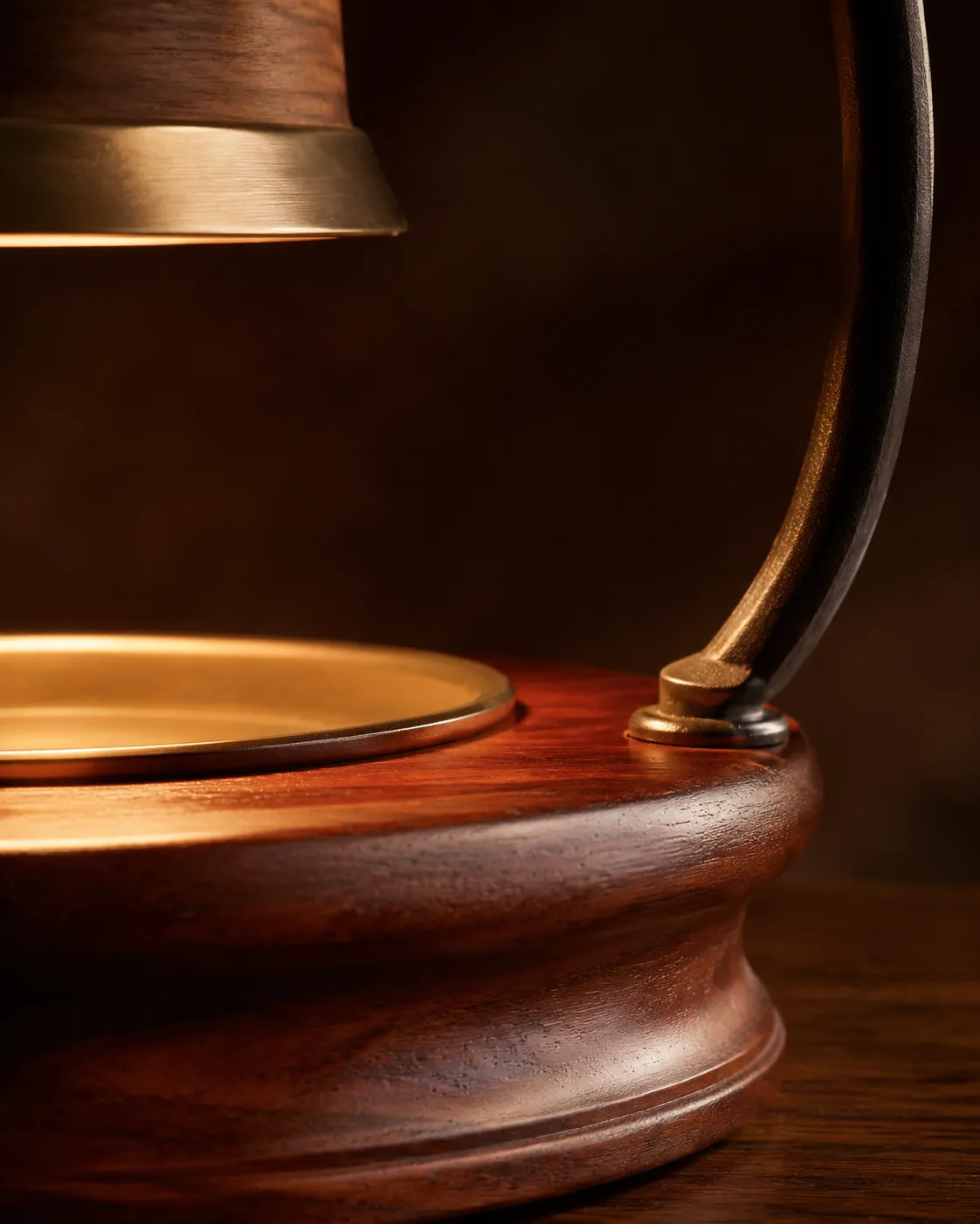 Macro detail of a turned wood base and powder-coated steel arm