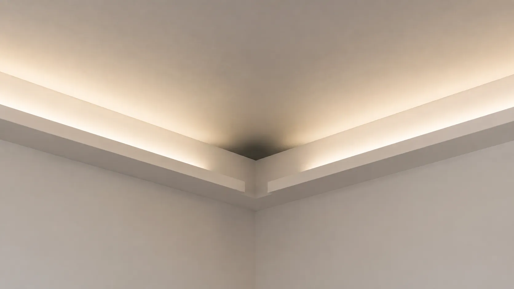 Internal corner of a ceiling cove with a dark wedge where two tape runs stop short of meeting