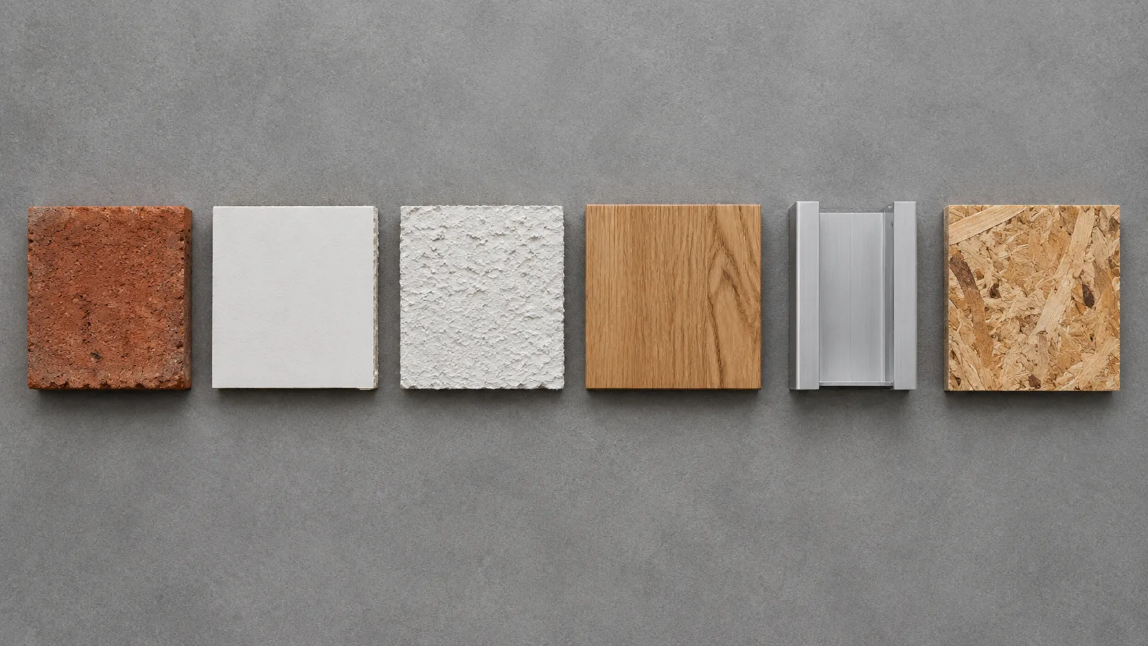 Six wall material samples laid side by side: brick, smooth drywall, textured drywall, timber, aluminium channel and OSB