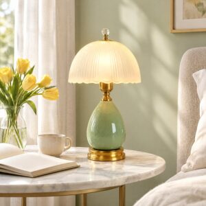 Green glazed ceramic table lamp with a ribbed frosted glass dome shade and gold-tone neck
