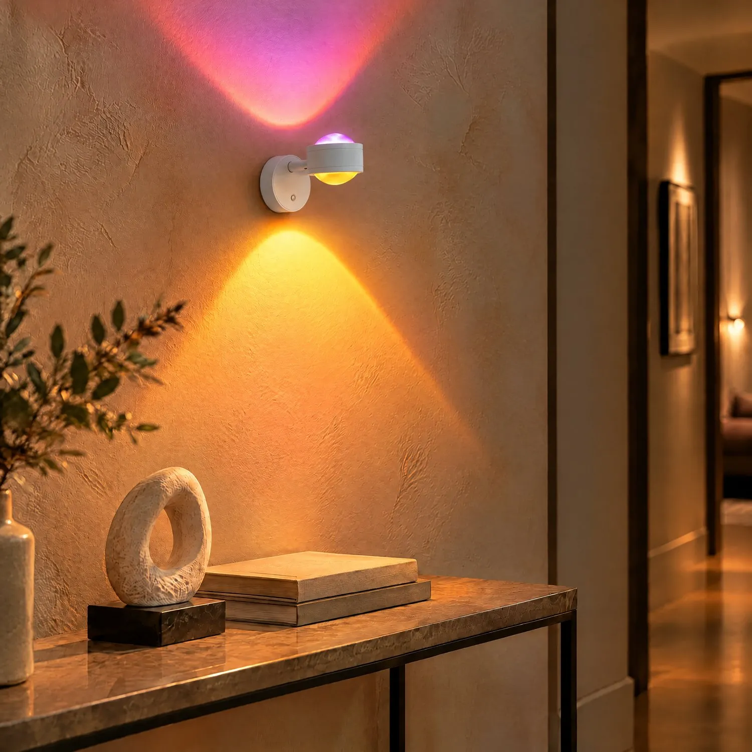 White double-head magnetic sunset wall light casting purple light upward and amber light downward in a hallway