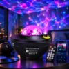Black bowl-shaped laser galaxy projector with a clear faceted dome and remote, casting purple ripples and green star dots overhead
