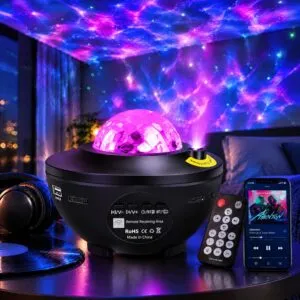 Black bowl-shaped laser galaxy projector with a clear faceted dome and remote, casting purple ripples and green star dots overhead